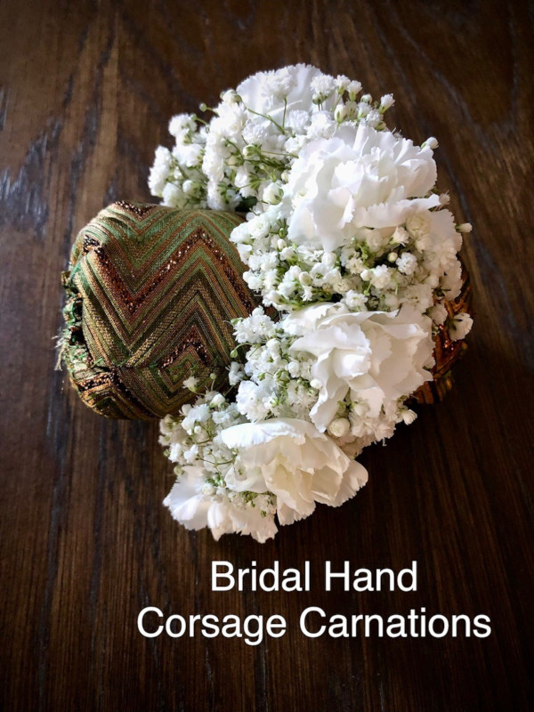 $25  each Bridal Hand corsage carnations                         